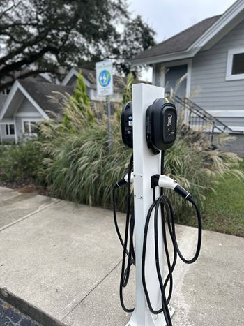 a electric charger in front of a house at The Monroe Apartment Homes, Florida, 32303